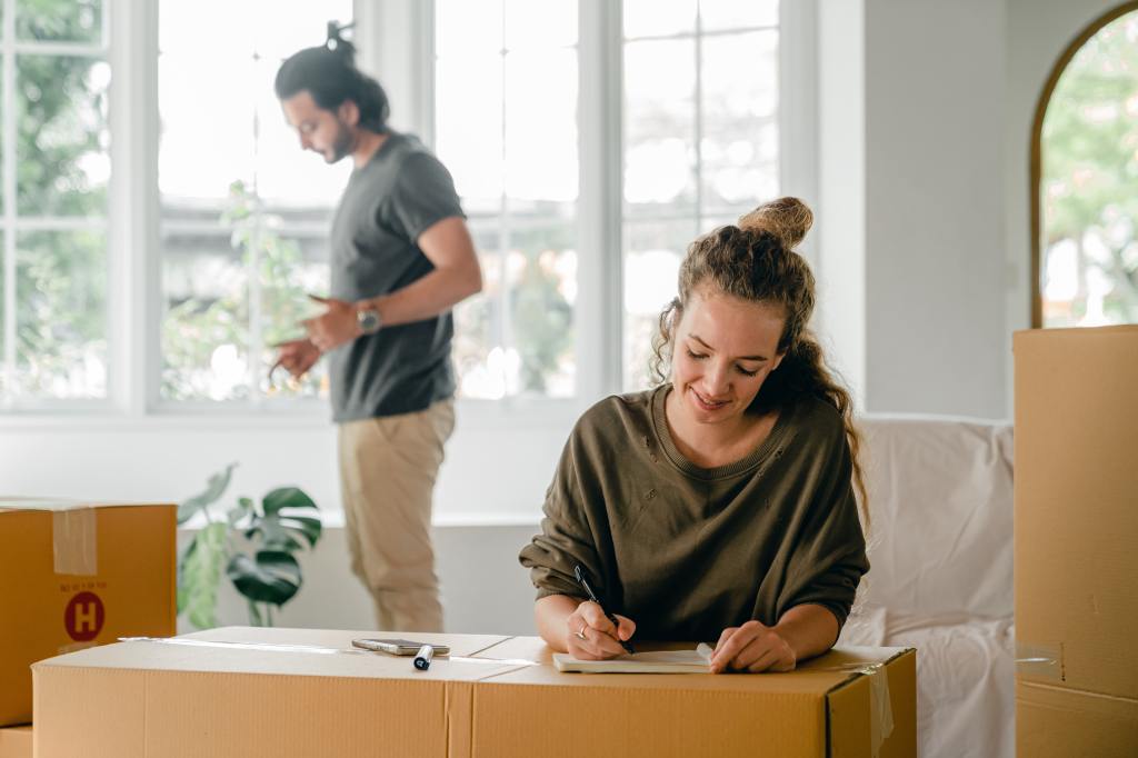 A young couple moving into a new home.