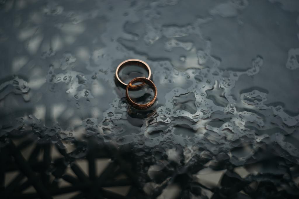 Two rings on top of a wet surface.