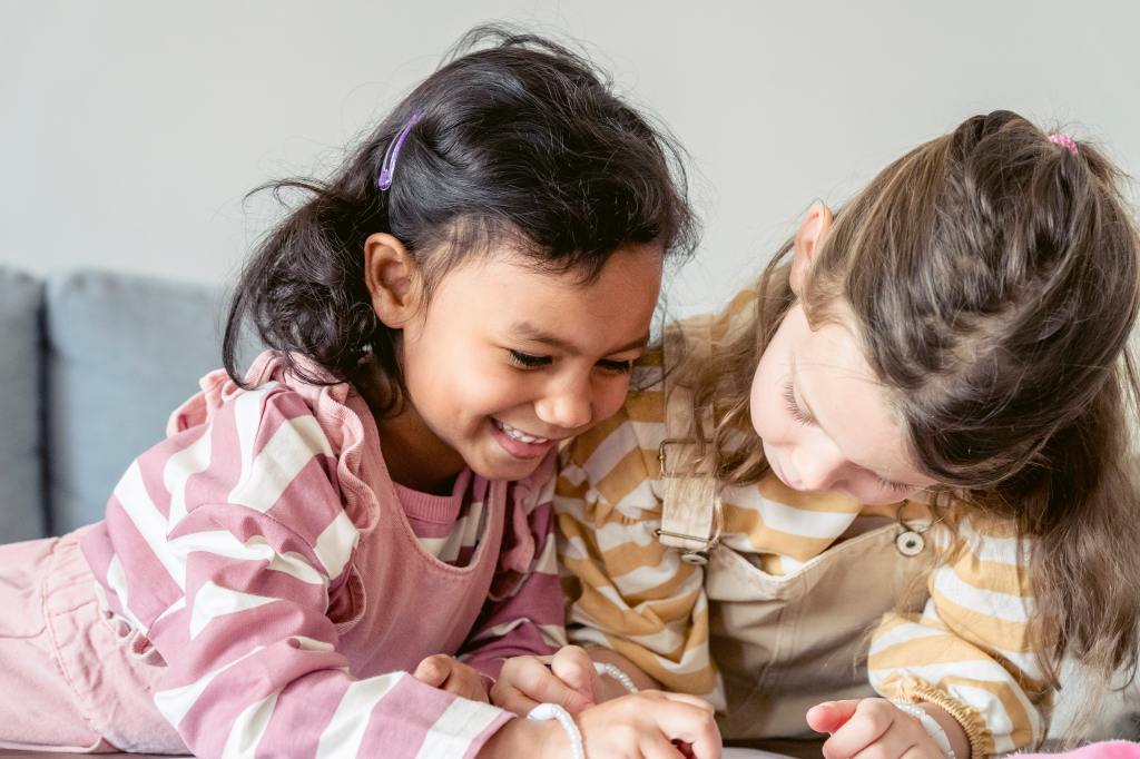 Two children coloring together.