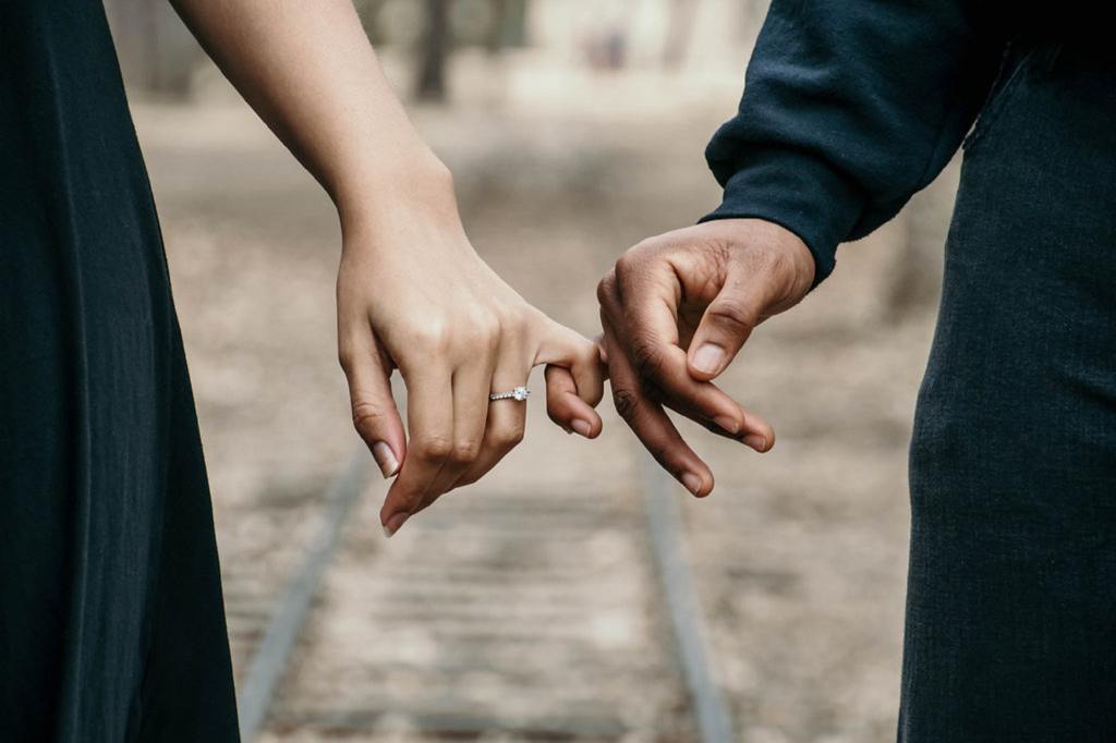 Two people holding hands.